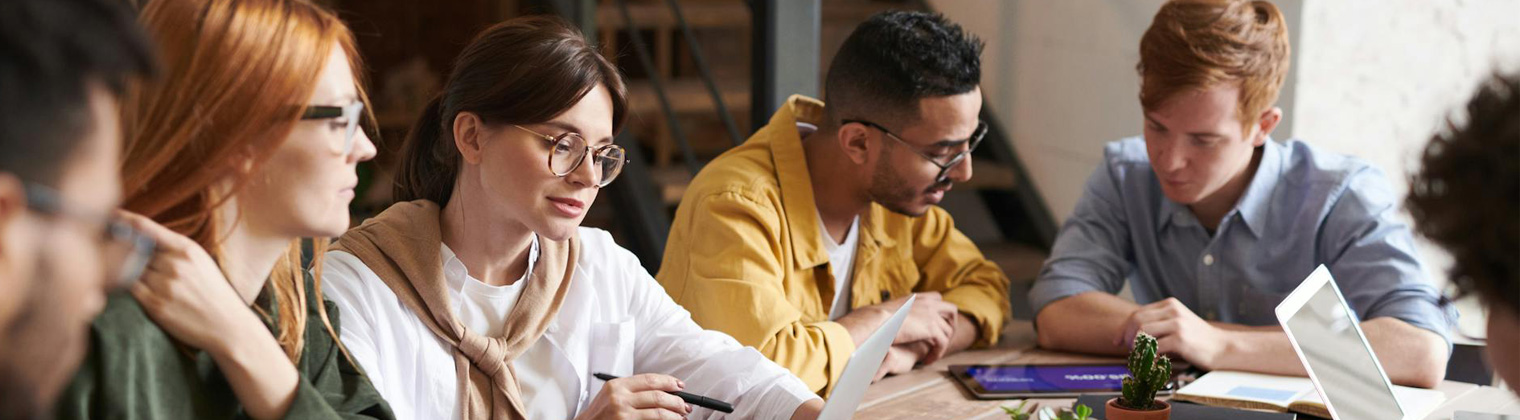 Image of different professionals discussing the result of the email marketing campaign for their business