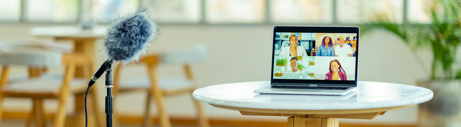 Image of a speaker recording a video of five professionals for YouTube video marketing