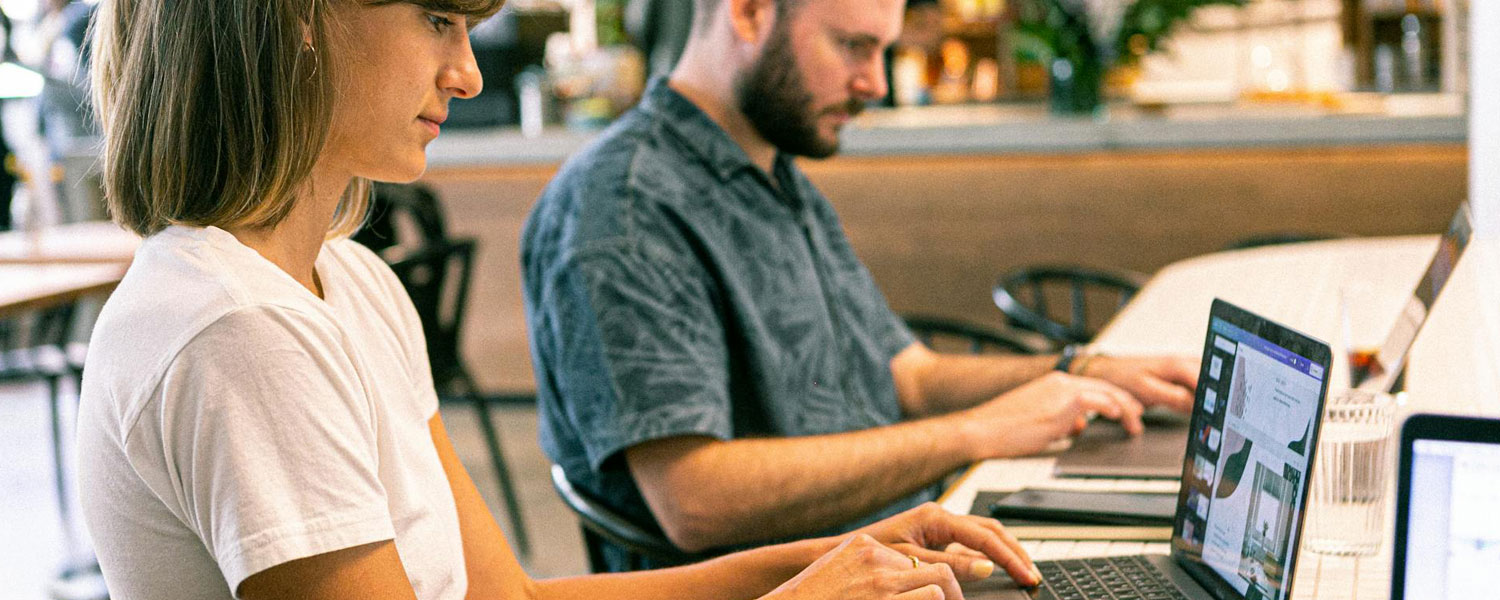 Two online shoppers check the available products on an E-commerce website