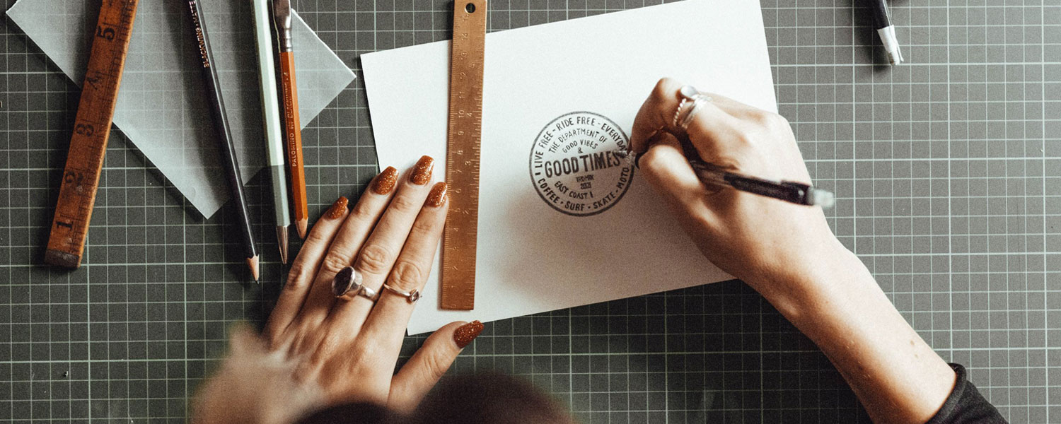 A female logo designer is designing a logo for her coffee shop